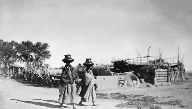 Two women walking through Santa Clara Pueblo
